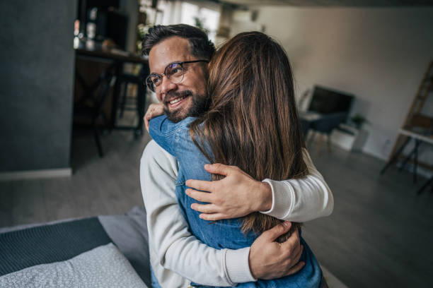 istock couple embracing at home 2191108819