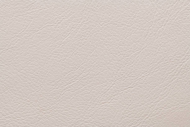 istock Cream-colored textured surface with fine, intricate lines and subtle variations in shading, resembling leather, providing a soft, elegant appearance 2191113896