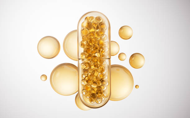 istock Medical capsule with golden bubbles background, 3d rendering. 2191116578