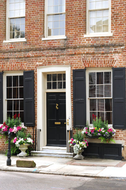 istock old building facade with window decorated with flower and flowerbox 2191120566