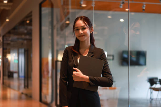 istock A Charming young Asian businesswoman using a digital tablet  and a smartphone online application for work  at the modern office and  Copy space 2191122152