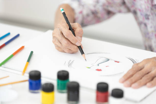 istock Old elderly drawing on paper,reduce stress,boredom and anxiety,helps to develop brain and memory,feel relaxed and focused,reduce the risk of Alzheimer's disease or dementia,mental and emotional health 2191125306