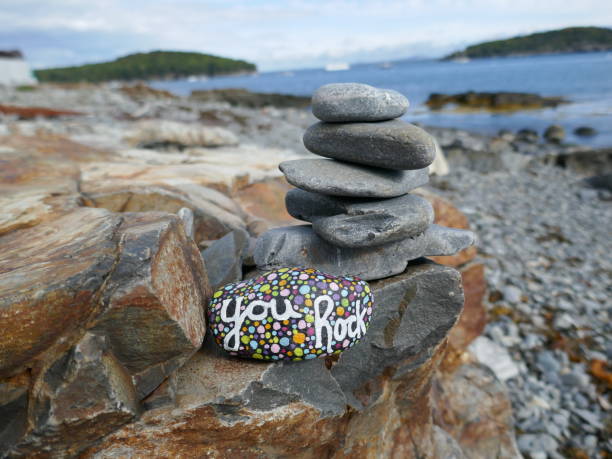 istock Ocean scene with you rock kindness rock and rock pile 2191125522