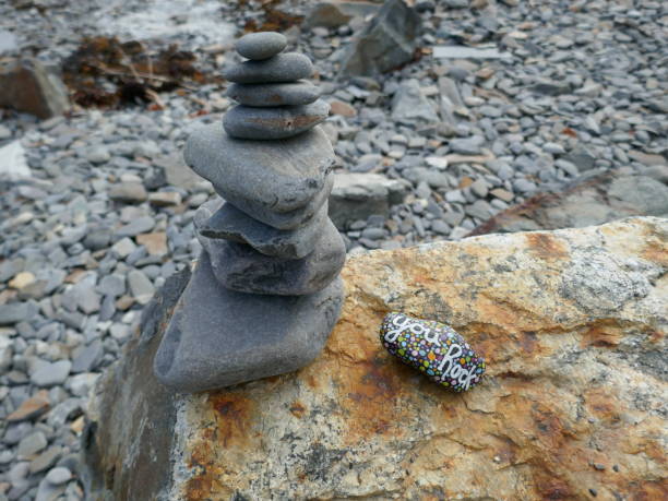 istock Cairn of stacked rocks with kindness rock 2191125564