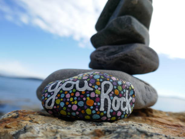 istock You rock kindness rock with stacked stones in background 2191125582