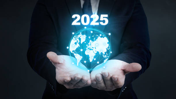 istock A businessman hand showing a virtual globe with a 2025 number. Planning, opportunity, challenge, and business strategy 2191125810