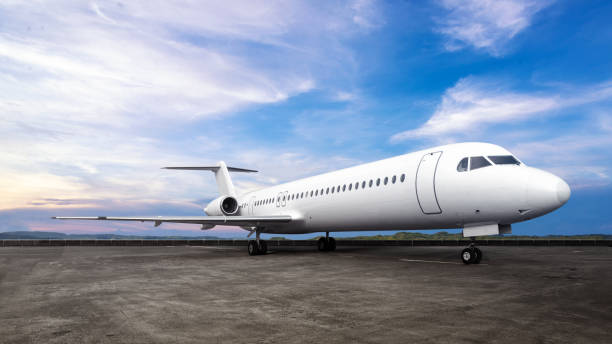 istock Commercial airplane on the runway with a blue sky background 2191126982