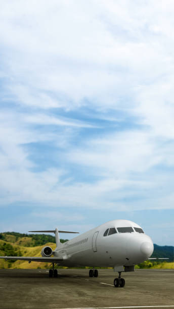 istock Commercial airplane on the runway with a blue sky background 2191126990