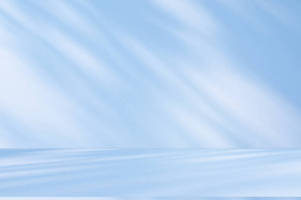 istock Studio style background wall decoration presentation uses white and blue tones. with shadows cast from a nearby window, concept creating a decorative 2191129848