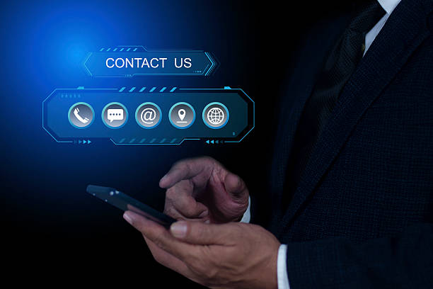 istock Businessman using a smartphone with virtual screen contact icons email, call phone, mail, address, live chat, Contact us or Customer support hotline people connect. Concept of contact us 2191132789