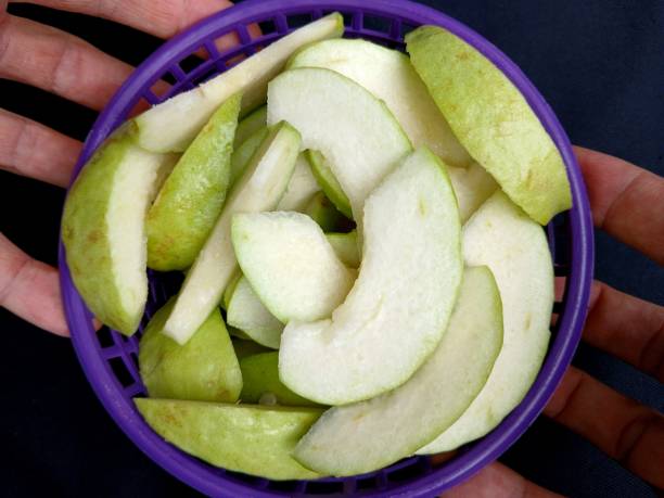 Cutting Guava Fruit - food preparation.