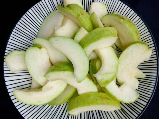 istock Cutting Guava Fruit - food preparation. 2191132941