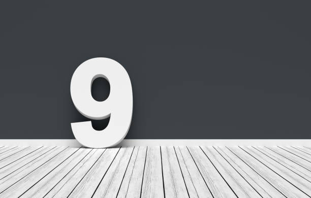 istock Number nine leaning on dark gray wall in white room 2191134494