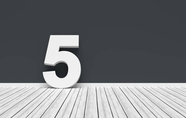 White number five leaning on a dark gray wall in a white room with wooden floor. 3D render.