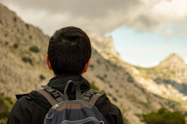 istock Man looking at a mountainous landscape 2191135644