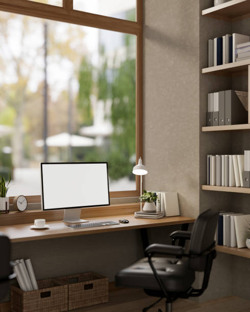 istock A comfortable, minimalist office featuring a computer with a white screen mockup on a wooden desk. 2191137047