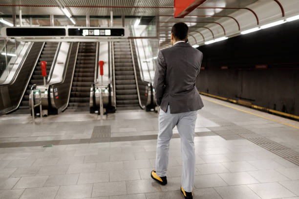 istock Businessman talking on mobile phone while leaving subway station 2191137207