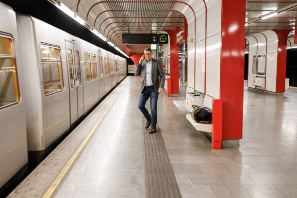 istock Businessman using smartphone on subway station 2191137554