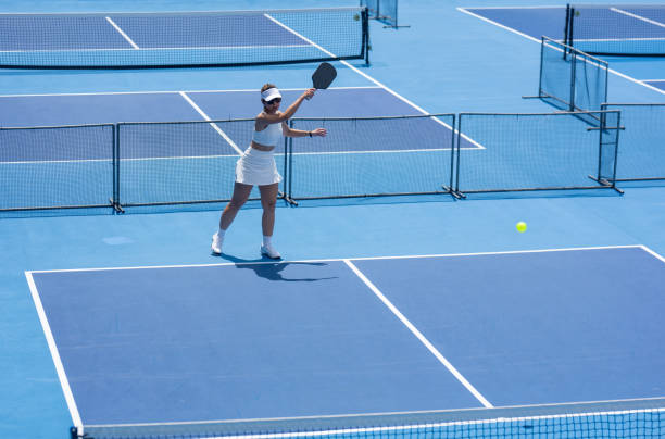 istock Grace Meets Power: Outdoor Pickleball Serve 2191137881