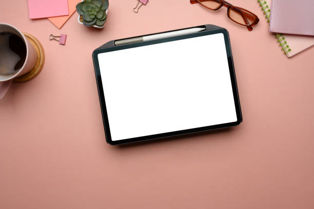 istock Feminine workspace with digital tablet on pastel pink background 2191138912