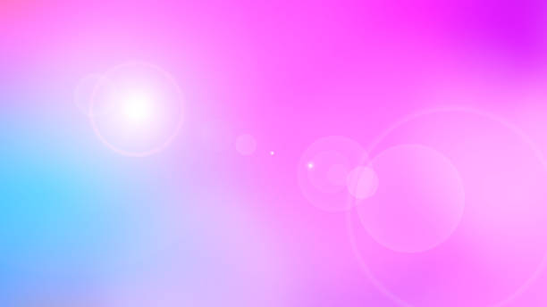 istock Soft Pastel Glow. A gentle gradient of pink and blue blends seamlessly, with circular light flares adding a dreamy, radiant effect. 2191139392