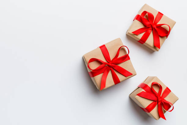 istock Valentine day composition: red gift box with bow and heart. Christmas present. View from above. Space for text. Holday greeting card 2191140800