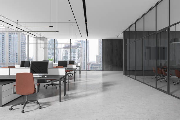 istock Modern open-plan office with large windows overlooking the city skyline and glass-walled meeting room. 3D Rendering 2191141604