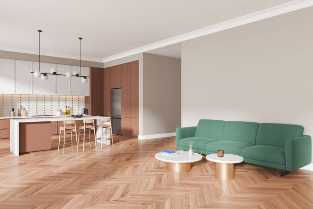 istock Stylish home interior with cooking and relaxing space with couch and fridge 2191141617