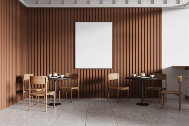 istock Empty poster on a brown wooden wall in a cafe setting with tables and chairs. Minimalist design concept. 3D Rendering 2191141846