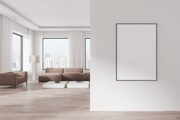 istock Modern living room with empty poster frame on white wall and city view in background. 3D Rendering 2191141943