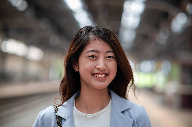 istock Young Asian female entrepreneur smiling and looking at camera 2191142885