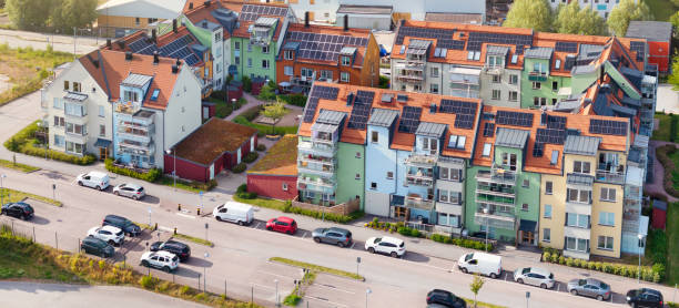 Aerial view of a modern residential district with solar panels installed on the roofs of the apartment buildings. Nyköping, Sweden.