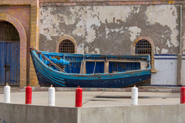 Small fishing boat on the dock in the port of the city of Essaouira in Morocco