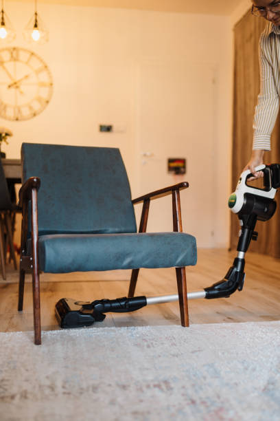 istock Person Vacuuming A Home Interior With A Modern Cordless Cleaner Device 2191147072