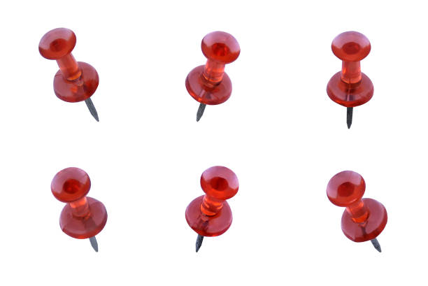 Red thumbtack on white background with shadows over it