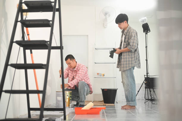 istock Two painters working on a painting project in an indoor space. 2191148531