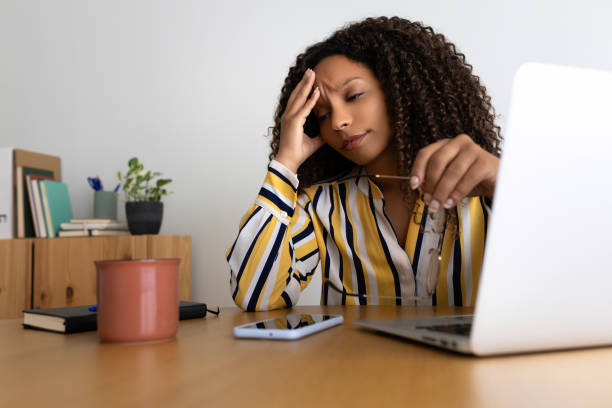 istock Stressed young woman suffering from headache while working from home 2191148873