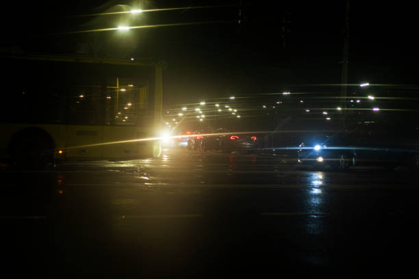 istock traffic jam at the intersection with a broken trolleybus late at night in the rain. Poor visibility on the road and safety 2191151637