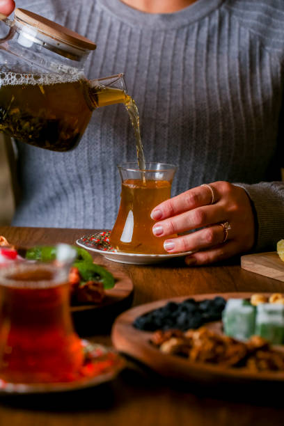 istock Enjoying a warm beverage with a platter of snacks in cozy setting 2191151648