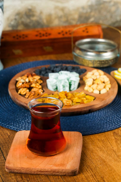 Traditional Turkish tea served with an assortment of snacks and sweets