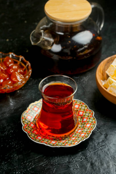 istock Traditional tea served with sweet snacks on a dark table 2191152156