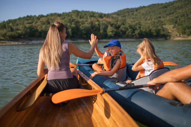 istock Family enjoying a kayaking on a peaceful lake 2191152522