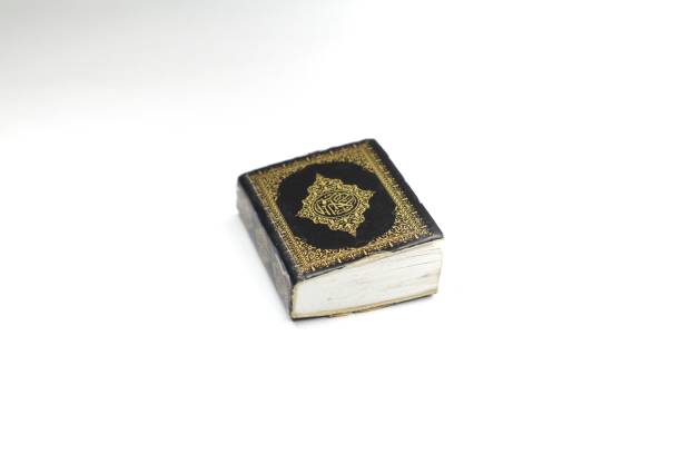 istock A small, black Quran is shown against a white background. 2191155179