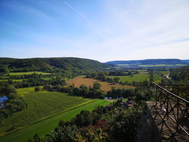 istock Scenic view of green fields and rolling hills. 2191156291