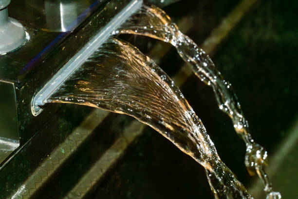 istock Water flowing from a modern faucet in a stylish bathroom setting 2191157200