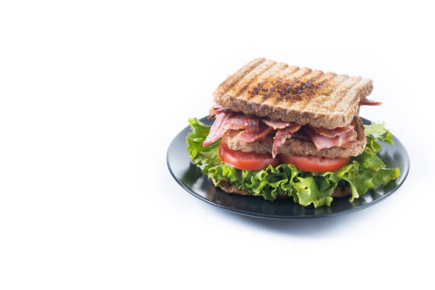 Bacon sandwich with lettuce and tomato isolated on white background
