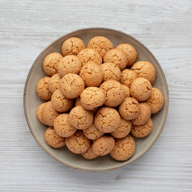 istock Homemade Italian Amaretti Cookie Biscuits on a Plate, top view. From above, overhead, flat lay. 2191159238