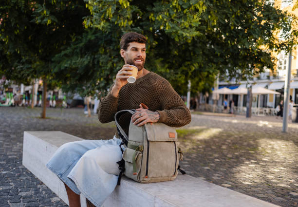 istock Tourist enjoying coffee break in portugal's charming square 2191160801