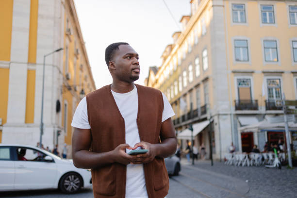istock Tourist using smartphone and walking in lisbon, portugal 2191161079