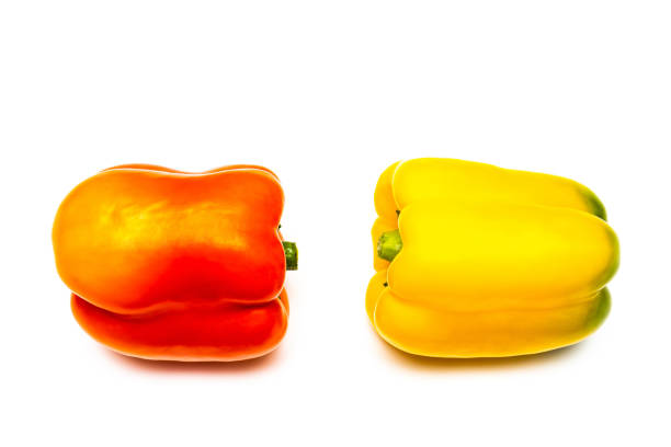 yellow and red bell peppers, on white background. several sweet peppers on a white background. bell pepper isolate. top view. High quality photo